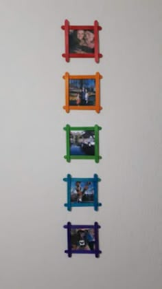 four different colored frames hanging on the wall