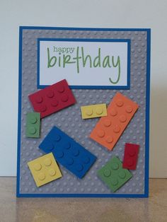 a birthday card with legos on it and a happy birthday sign in the middle