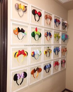 the wall is decorated with mickey ears and other headbands on it's sides