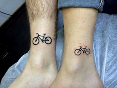 two people with matching tattoos on their feet, one has a bike tattoo on the other