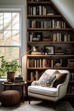 a living room with bookshelves and a chair in front of a large window