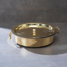 a gold platter on a gray table