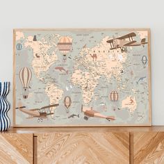 an airplane map on a wall above a dresser