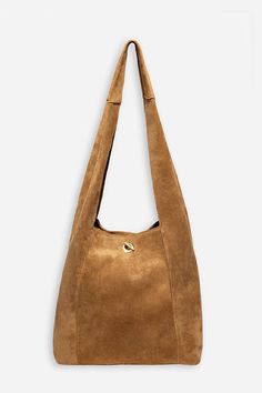 Crafted from 100% rich suede, the Tassel Chain Italian Suede Hobo Bag is perfect for daily use. Featuring a comfortable shoulder strap and wide top opening, this classic hobo style bag is finished with a decorative leather tassel at the front and a hook and eye closure. Pair with relaxed fit jeans and a casual blouse for a classic weekend look. Johnny Was Women's Tassel Chain Italian Suede Hobo Bag in Tan Brown, Leather/Suede Chic Hobo Bag With Suede Lining Tote Shape, Chic Suede Hobo Bag For Everyday, Chic Suede Shoulder Bag For Travel, Chic Suede Shoulder Bag For Daily Use, Elegant Hobo Bag With Suede Lining, Elegant Suede Hobo Bag For Everyday Use, Elegant Hobo Bag With Suede Lining For Everyday Use, Elegant Everyday Hobo Bag With Suede Lining, Chic Suede Hobo Bag With Soft Leather