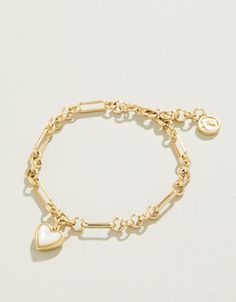 Capture that warm feeling of a full heart in this charming Full Heart Bracelet. A thick piece of shimmering mother-of-pearl is set in a lustrous 18kt matte gold plated setting on a detailed chain. Timeless and lovely. Women's Full Heart Bracelet Mother-of-Pearl by Spartina 449 Gold Stack Bracelets, Wishlist Items Aesthetic, Pretty Jewellery Gold, Cute Gold Jewelry, Cute Charm Bracelets, Gold Jewlry, Gold Jewelry Bracelet, Good Bracelet, Fantasy Earrings