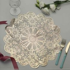 a place setting with silverware and flowers