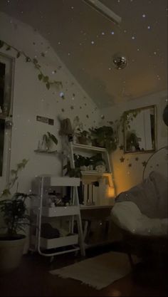 a living room filled with furniture and lots of plants