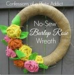 a wreath made out of burlap and flowers on the front door with words that say no sew, birthday rose wreath