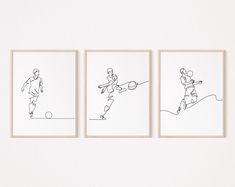 three framed drawings of people playing tennis against each other on a white wall in a room