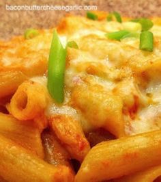 pasta with cheese and green onions on top