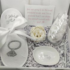 a white box with some personal items in it and a card that says i love you