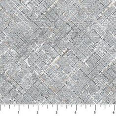 a gray and white area rug that has been made with squares, lines, and rectangles