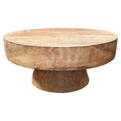 a round wooden table sitting on top of a white background