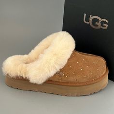 Brand: UGG Australia Model: Disquette embellished with beautiful Swarovski Rhinestones  Swarovski color: Golder Shadow   Style#: 1122550 Color: Chestnut Size: US8 Measurement - insole inches 10 from heel to toe  Material: Suede Buyer will receive slippers And box displayed in listing photos ( slippers have been reboxed in white shoebox. Original box was damaged) All merchandise is guaranteed authentic. See left slipper hologram tag  -size labels have been marked with red marker  to prevent store returns! ALL ORDERS SHIP PRIORITY MAIL WITH SIGNATURE CONFIRMATION. PLEASE MAKE SURE YOUR ADDRESS IS CORRECT. LABELS ARE PRINTED THROUGH ETSY.  NO ADDRESS CHANGES AFTER PURCHASE TO PREVENT FRAUDULENT TRANSACTIONS.  ALL SALES ARE FINAL Brown Uggs, Cute Uggs, Colorado Style, Gamer Pics, Winter Gear, Ugg Slippers, Girly Shoes