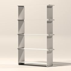 a white book shelf with four shelves on each side and one in the middle, against a light gray background