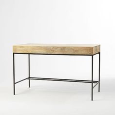 a wooden table with metal legs and a drawer on the top, against a white background