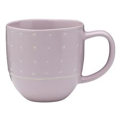 a purple coffee cup with white dots on it