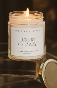 What it is: A luxe scented candle in a minimalist jar that adds personality and dreamy fragrance to your space. - Pink Grapefruit: A citrusy blend of grapefruit, orange, strawberry, jasmine and vanilla- Luxury Getaway: The perfect blend of leather, iris and sandalwood- Flower Shop: A sweet blend of jasmine, bergamot, pink peppercorn and rose 2.75" x 2.75" x 3.5" 9 oz. 40-hour approximate burn time Soy-wax blend/fragrance Made in the USA Luxury Candle Label Design, Storage Box Design, Luxury Candles Packaging, Luxury Candles Packaging Boxes, Luxury Candle Jars, Candle Storage, Neom Candles Luxury, Water Decor, Pink Peppercorn