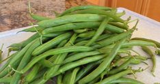 some green beans are on a cutting board