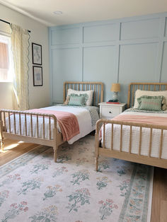 two twin beds with a blue board and batten wall Two Twin Beds In A Small Room, 3 Sisters Bedroom Ideas, Twin Teen Girls Bedroom Ideas, Twin Bedroom Layout Small Rooms, Room With 2 Twin Bed Ideas, French Inspired Girls Bedroom, Gender Neutral Twin Bedroom, Twin Bed Girls Room Ideas, Twin Girls Bedroom Toddler