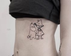 a woman with a dog tattoo on her stomach and the bottom part of her belly