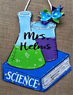 a blue book with a purple beakle on it and the words, mrs helms science