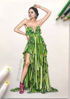 a drawing of a woman in a green dress with her hand on her hip, and two pencils next to it