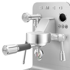 the smego espresso machine is shown with its attachments attached to it