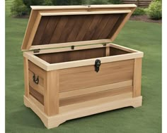 an open wooden chest on the grass