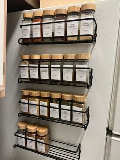 the spice rack is filled with many different kinds of spices