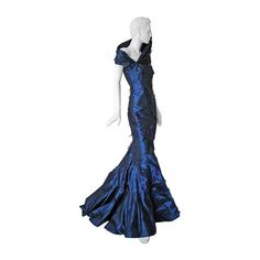 A rare Christian Dior by John Galliano f/w 1999 sapphire blue eyelash silk bias cut gown. Designed with the utmost attention to couture detailing and sophisticated construction. Gown is created with impressive sculptural details such as the asymmetrical collar and bias cut panels that drape the body. An exceptional and early creation of haute couture fashion by John Galliano for the House of Dior. Unlined; side zipper closure. A striking silhouette on the red carpet! Size: 38; bust: 33.5”; waist Red Carpet Dresses Elegant, Red Carpet Dresses Long, Couture Dresses Gowns, Dior Couture Dresses, Red Carpet Dresses Best, Dior By John Galliano, Vintage Evening Gowns, Asymmetrical Collar, Curvy Petite Fashion