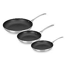 three black frying pans sitting side by side