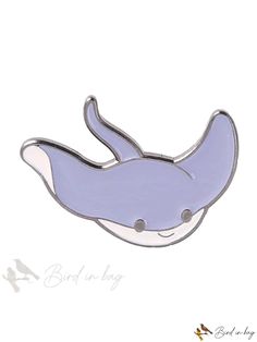 a blue and white pin with a whale on it