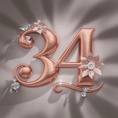 the number 34 is decorated with flowers and diamonds