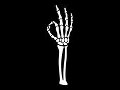 a skeleton hand is shown on a black background