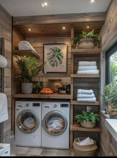 a washer and dryer in a room with wood paneling on the walls