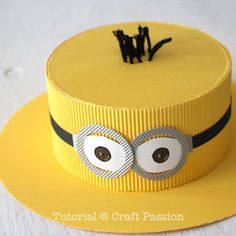 a yellow hat with googly eyes on it