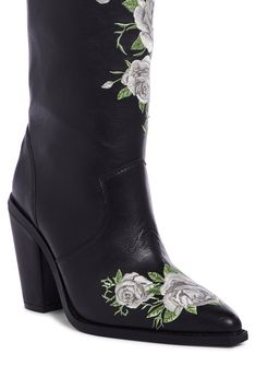 cuz you look like a beauty in the cemetery. These cowboy boots have a vegan leather construction, an embroidered rose design on the front and back of the heel, pointed toes, block heels, and a slip-on fit. Rose Boots, White Cowgirl Boots, Embroidered Rose, Wedding Boots, Free Socks, Rose Design, Cowgirl Boots, Black Rose, Dolls Kill