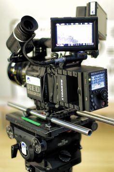 a video camera sitting on top of a tripod