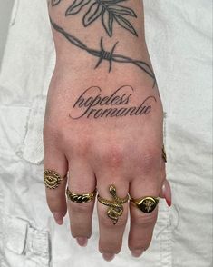 a person with two rings on their fingers and the words repossi romania written in cursive writing