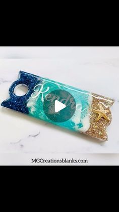 the video is showing how to make an origami bottle opener with glitter and glue