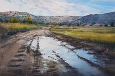 an oil painting of a dirt road in the middle of a field with mountains in the background