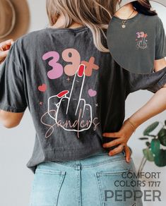 "I Am 39+ Middle Finger Shirt, Personalized 40th Birthday Tshirt, Custom 1984 Birthday Party T-Shirt, Funny I Am 39 Plus T Shirt, 40 Bday Tee HOW TO ORDER ➀ Select color ➁ Select the size (Please check size chart) ✦ True to size. Size up 1-2 sizes for an oversized look. ➂ Add to cart ✦ (Optional) \"Add message to Seller\" on the checkout page. GARMENT FEATURES ✦ Crew neckline ✦ Direct to garment printing - no vinyl, decal, or iron-on technique ✦ Our designs are printed on the garment to last a long time and may not appear as 'glossy' or saturated as iron-on designs are. ✦ Please note that colors may appear different on different digital screens and may not be a true representation of the actual colors. ✦ Additional T-Shirt Colors and Sizes Available Upon Request ✧✧Brands: Bella Canvas Unis 30th Birthday Tshirt, 1984 Birthday, Tshirt Custom, 1st Birthday Shirts, 30th Bday, Birthday Planning, Future Mrs, Birthday Tshirts, T Shirt Funny