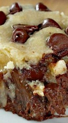 a close up of a piece of cake on a plate with chocolate and marshmallows