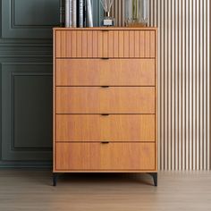 a tall wooden dresser sitting next to a wall