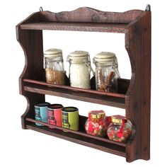 a wooden shelf with jars and spices on it