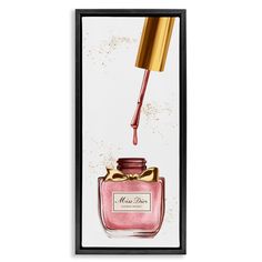 a pink perfume bottle with a gold top on it and a red liquid pouring out of it