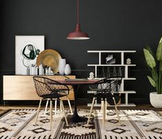 a dining room with black walls and white rugs on the floor, two chairs in front of a table