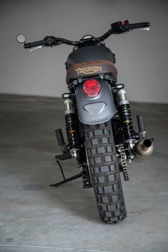 the back end of a motorcycle parked in a garage