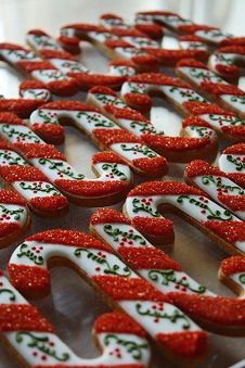 decorated cookies are arranged in the shape of letters